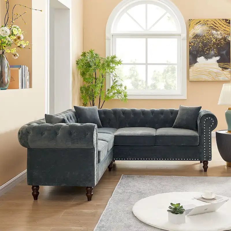 L-shaped sofa with deep-stitched details and curled armrests.